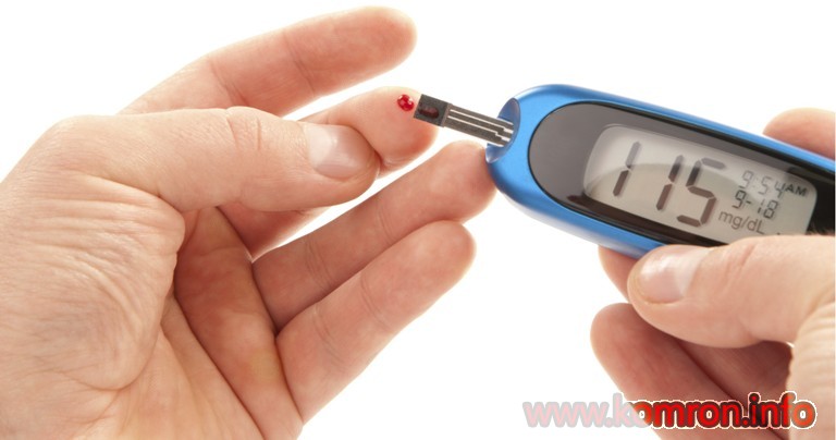 Diabetic patient doing glucose level blood test using ultra mini glucometer and small drop of blood from finger and test strips isolated on a white background. Device shows 115  mg/dL which is normal